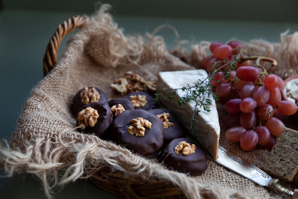 Chocolate Coated Candied Figs taking pride of place on a cheeseboard.